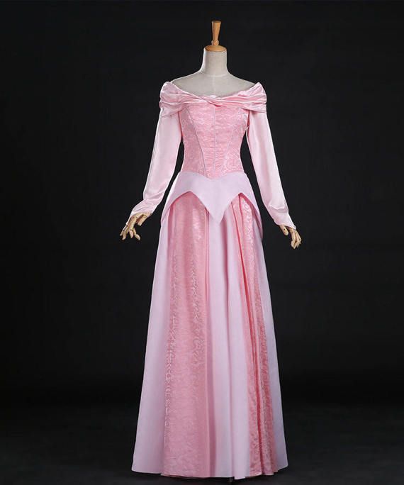 a pink dress with long sleeves on display