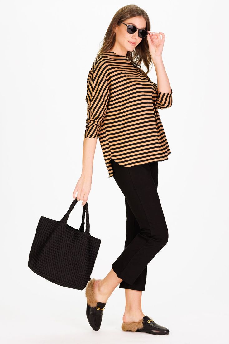 Meet the Betsy! This will be your go-to top all season long. Made from the softest and stretchiest fabric, this relaxed-fit top makes dressing a breeze! Pair it with our traveling pants for the perfect fall outfit! FEEL: (45% Rayon 50% polyester 5% spandex) This sumptuously soft Fall Stripe is crafted for comfort and style. This fabric boasts a timeless stripe pattern that not only feels incredibly soft but also exudes a classic charm perfect for the fall season. FAVORITE FEATURES: Raw hems Soft Oversized Casual Knit Top For Work, Effortless Tops For Fall Day Out, Effortless Tops For Day Out In Fall, Chic Textured Knit Tops For Loungewear, Chic Stretch Blouse For Everyday, Chic Textured Knit Blouse For Fall, Chic Everyday Stretch Blouse, Relaxed Fit Knit Top For Workwear In Fall, Casual Black Knit Top For Day Out