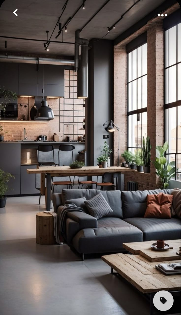 a living room filled with furniture and lots of windows