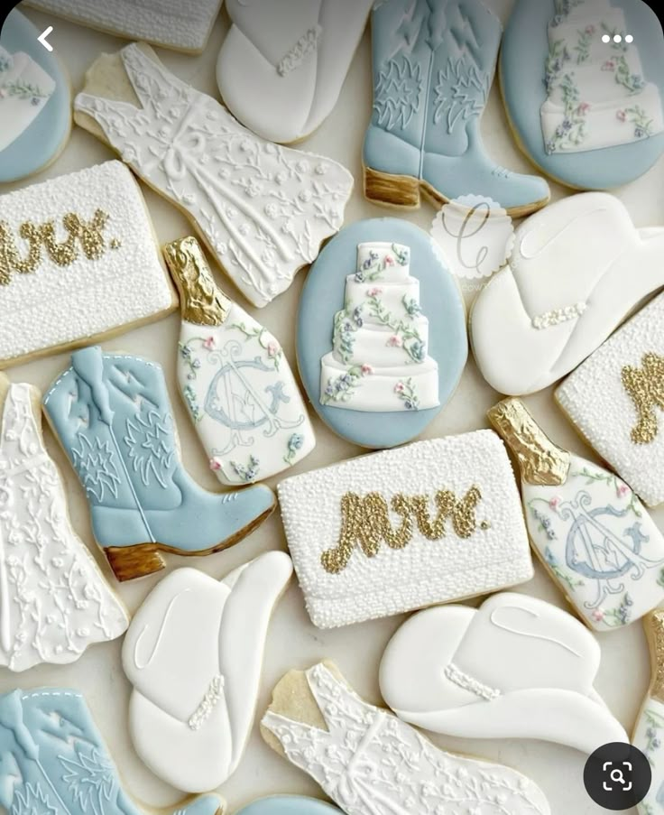 decorated cookies are arranged in the shape of baby booties, mittens and boots