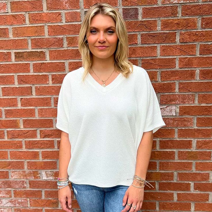 Introducing our chic and contemporary women's fashion top, where style meets comfort effortlessly. The cocoon sleeves add a modern twist, offering a relaxed yet flattering silhouette that drapes beautifully. Whether you're heading to a brunch date or a casual evening out, this versatile piece effortlessly transitions from day to night. Pair it with your favorite jeans for a laid-back vibe, or dress it up for a polished look. Fall Faves, Southern Women, Brunch Date, Casual Evening, Fashion Top, Short Rompers, Oversized Tee, Dress Romper, Ladies Tops Fashion