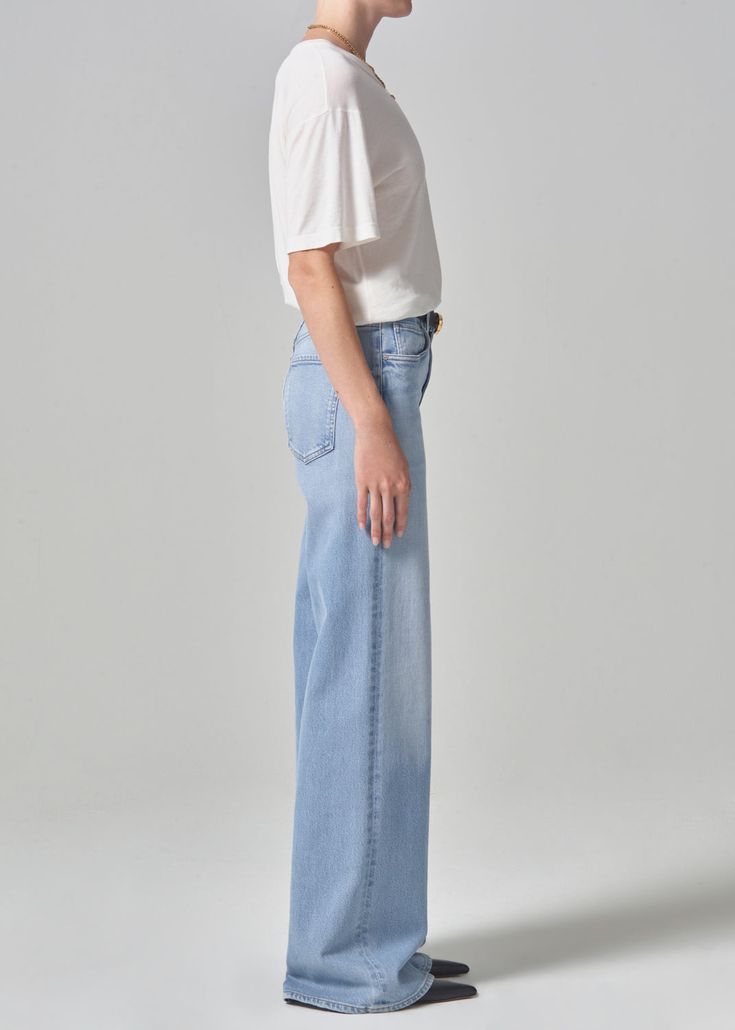 The Loli features an ultra-flattering mid-rise waist that sits higher up on the hip with an easy, relaxed wide leg. The 32" inseam lengthen the leg for a look that can be easily dressed up or down. This fit is true to size. Looks Like: Light indigo with fading and finished hems Feels Like: Signature soft stretch denim designed to hold its shape all-day From our HUMANITY Collection