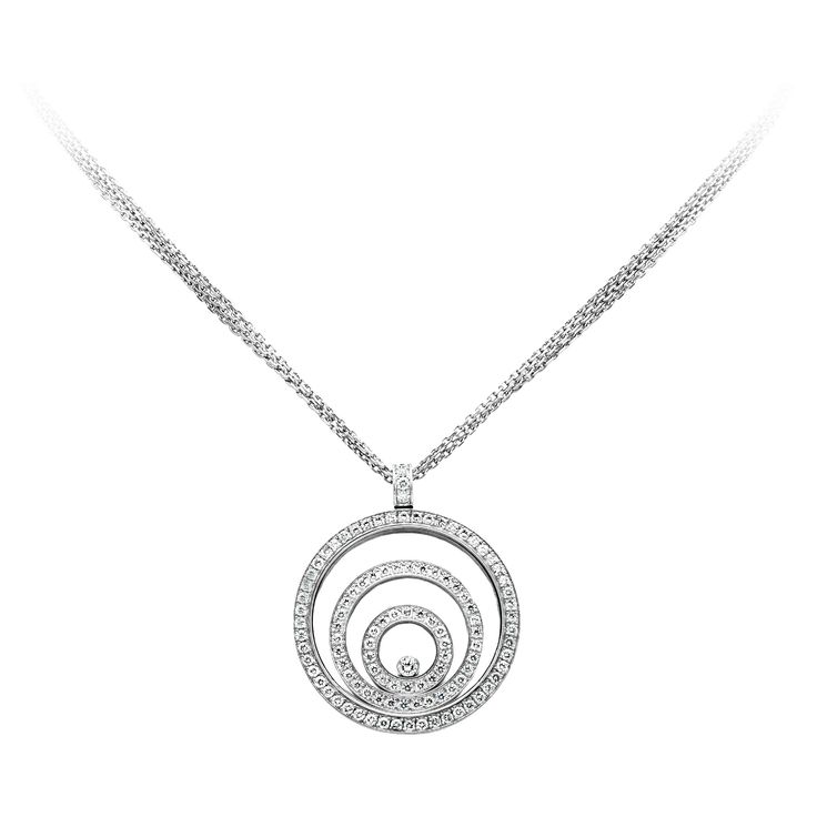 This gorgeous Chopard necklace is from the Happy Spirit Collection. The pendant is decorated with 2 concentric circles encased in the pendant and is set with brilliant round diamonds weighing 1.88 carats. A 0.10 carat round brilliant happy diamond floats at the center. With original Chopard triple strand chain made in 18k white gold. Reference Number: 297 3033 79/5423/0-12 Chopard Necklace, Gold Reference, Concentric Circles, Diamond Pendant Necklace, The Happy, Diamond Pendant, Round Brilliant, Round Diamonds, Circles