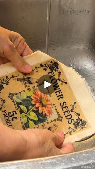 a person is making a flower seed packet in a kitchen sink with the words on it