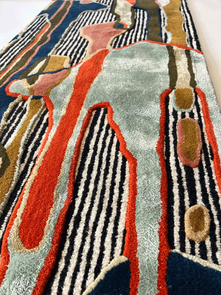 an area rug with various colored designs on it