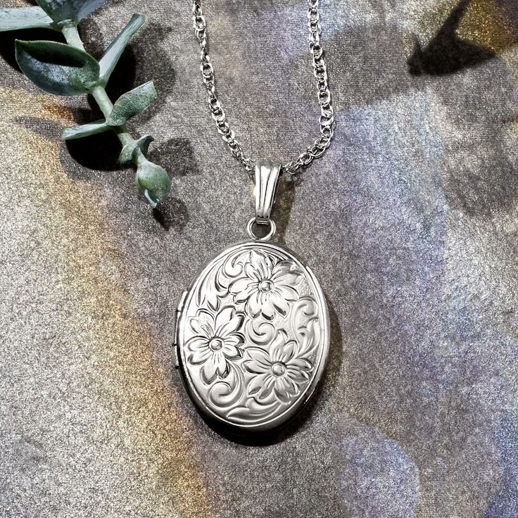 Ross-Simons - Single Initial - 14kt White Gold Floral Locket Necklace. 18". Etched with a scrolling floral motif, our 14kt white gold oval locket necklace has the aura of a vintage-style keepsake. Make it meaningful with a FREE engraving on the back of a single initial in your choice of block or script type. Fits a 7/16" x 5/8" photo inside. Suspends from a rope chain. Satin and polished finishes. Springring clasp, 14kt white gold personalized floral locket necklace. Vintage Locket Necklace, Oval Locket Necklace, Locket Necklace Vintage, Vintage Locket, Oval Locket, Vintage Lockets, Script Type, A Monogram, Gold Floral