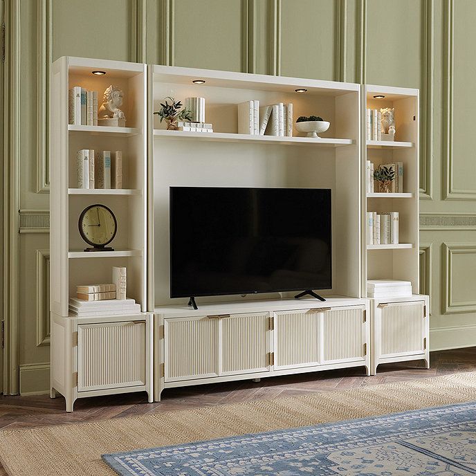 a large entertainment center with bookshelves and shelves