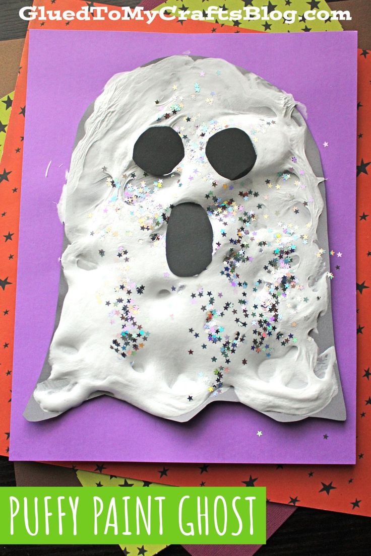 a paper plate ghost with sprinkles on it and the words puffy paint ghost