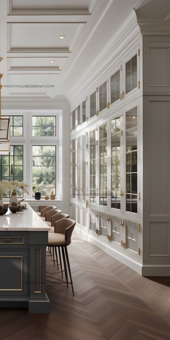 a large kitchen with an island in the middle and lots of cabinets on either side