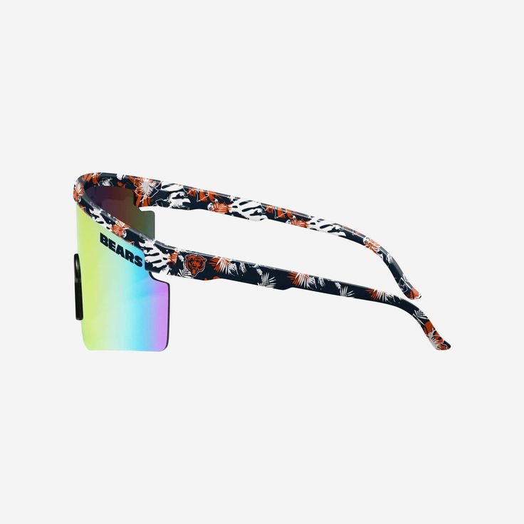 You've got it made in these shades. Kick back, relax, and support your squad in style with the Chicago Bears Floral Large Frame Sunglasses. Features Shield sunglasses with gradient lenses, the perfect look for every sunny day Floral, team-colored design on rim and temples so you can rep the team in style Printed wordmark team name display on upper corners of lens, in case there were any doubts where your allegiances lie Comfortable nose pad to keep you comfy on those extended afternoons outdoors