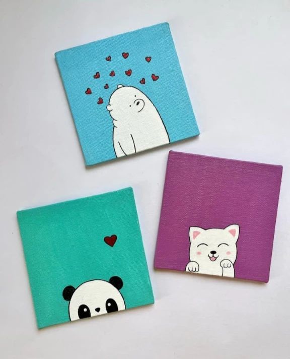 three small square paintings with animals painted on them