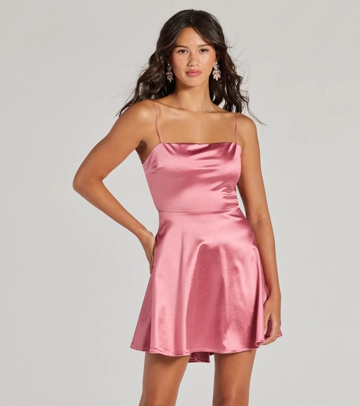 Make a grand exit after your formal affair in this flirty satin skater dress! Designed with a shiny stretch-satin fabric, it features a sleek sleeveless square neckline, bungee spaghetti straps, a bold open back with a dual bar strap design, and a fitted high waist that flares out to a short skater silhouette. Complete your look with a rhinestone necklace and earrings set and block heels.Fit & FeaturesShiny stretch-satin fabricSquare necklineBungee spaghetti strapsOpen back, dual bar strap d