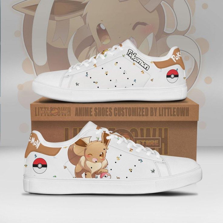 a pair of white sneakers with pokemon characters on the front and side, sitting next to a cardboard box