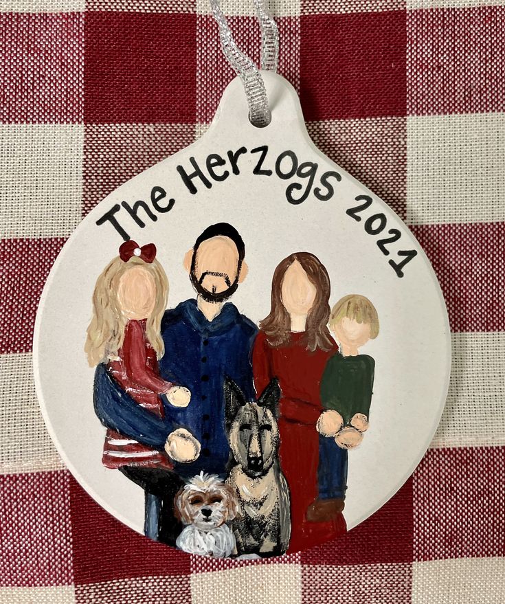 a ceramic ornament with family pictures on it