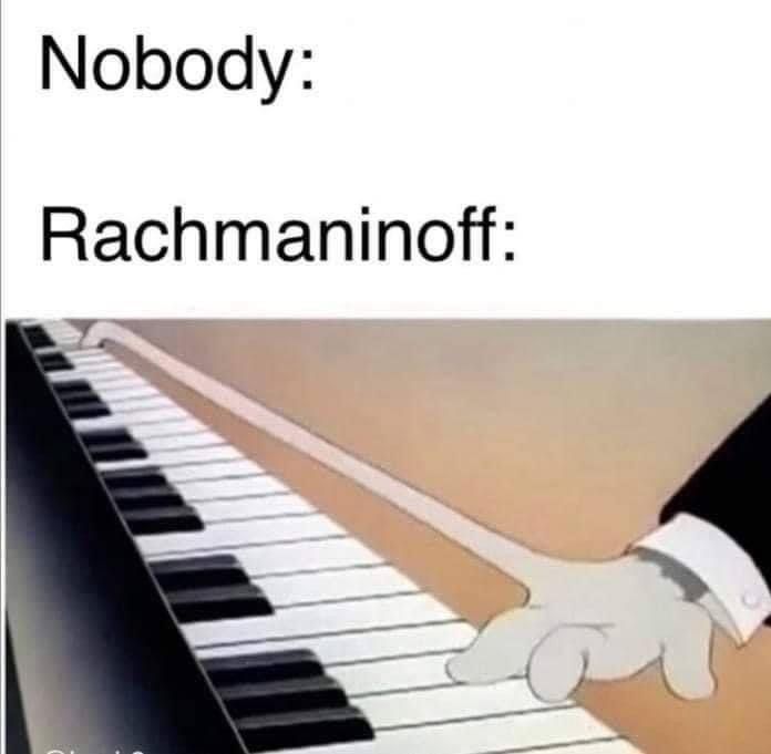 a hand that is on top of a piano keyboard with the caption nobody rachnannoff