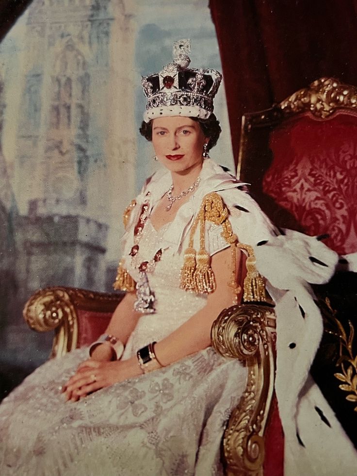 an old photo of a woman wearing a tiara and sitting on a gold chair