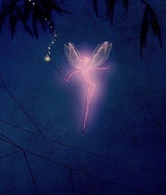 a pink fairy angel flying through the night sky with its wings spread out and lights on