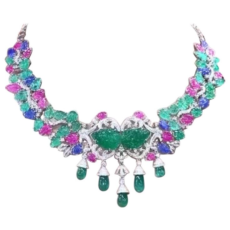 A master piece necklace , so magnificent , refined and chic style, for glamour ladies, by Italian designer, a very piece of art. Necklace come in 18k with 2 centre natural Untreated Carving Zambian Emeralds of 22 carats, extra fine quality; 29 pieces of Untreated Carving Zambian Emeralds of 26 carats, extra fine quality; 5 pieces of natural Zambian Emeralds in perfect drop cut of 24 carats; 10 pieces of Untreated Carving Burma Sapphires , extra fine quality, of 13 carats; 19 pieces of natural Untreated Carving Burma Rubies , extra fine quality, of 17 carats, and 585 pieces of natural diamonds in round brilliant cut of 6,43 carats, F color VS clarity, top quality. I can customize also length on request. Piece of high jewelry. Handcrafted by artisan goldsmith . Excellent manufacture and qual Rubies Necklace, Art Necklace, Master Piece, Zambian Emerald, Estilo Chic, Italian Designer, Sapphire Necklace, High Jewelry, Zambia