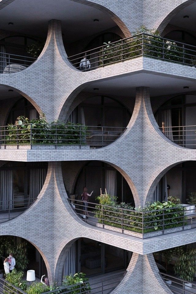 the building has many balconies and plants growing on it's balconyes