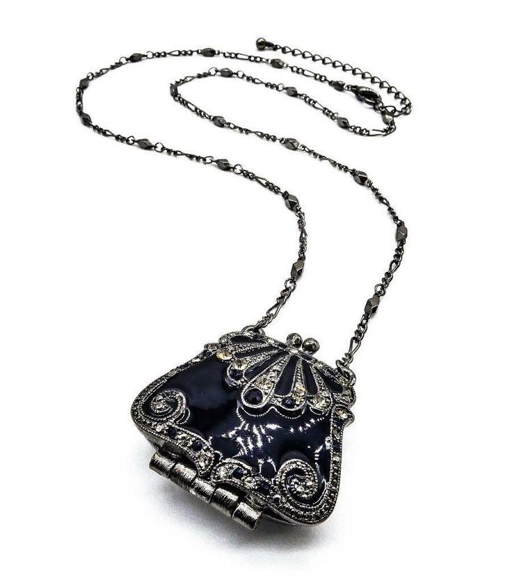 VICTORIAN Black Enamel Smoky Crystals Purse Locket Pendant 22" Chain Necklace VICTORIAN Black Enamel Smoky Crystals Purse Locket Pendant 22" Chain Necklace Click images to enlarge Description UNIQUE Black Lacquer Enamel Smoky Gray Black Crystals Purse Bag Locket Pendant 22" Antique Chain Long Necklace     Victorian Elegance!  This gorgeous unique victorian style necklace features a black lacquer enamel smoky gray & black crystals encrusted antique metal purse bag locket pendant on 22" antique me Black Enamel Party Jewelry, Elegant Enamel Necklace With Chain, Collectible Black Locket Jewelry, Silver Enamel Jewelry For Evening, Black Nickel-free Chain Necklace For Gift, Nickel-free Black Chain Necklace Gift, Black Nickel-free Chain Necklace, Black Metal Collectible Necklaces, Black Metal Necklace With Locket