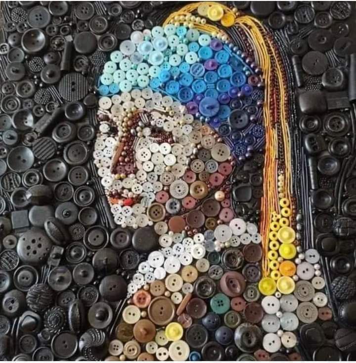 a painting made out of buttons with a woman's head in the center and colorful hair