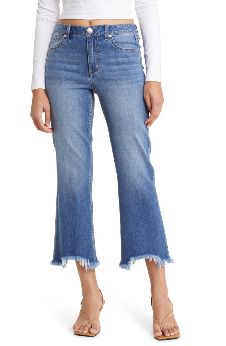 Keep it casual and cool in these faded high-waist jeans styled with light distressing and fringed, flared hems. 26" inseam; 18" leg opening; 10" front rise; 16" back rise Zip fly with button closure Five-pocket style 46% lyocell, 26% cotton, 15% rayon, 12% polyester, 1% spandex Machine wash, tumble dry Imported Women's Clothing High Waist Jeans Style, Raw Hem Jeans, Hem Jeans, Waist Jeans, High Waisted Denim, High Waist Jeans, Jeans Style, Bottoms Pants, Jeans Pants