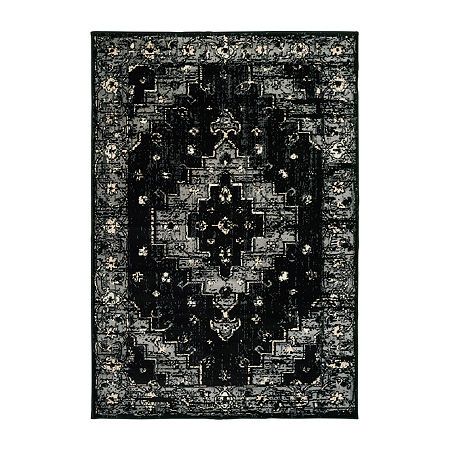 a black and white rug with an intricate design