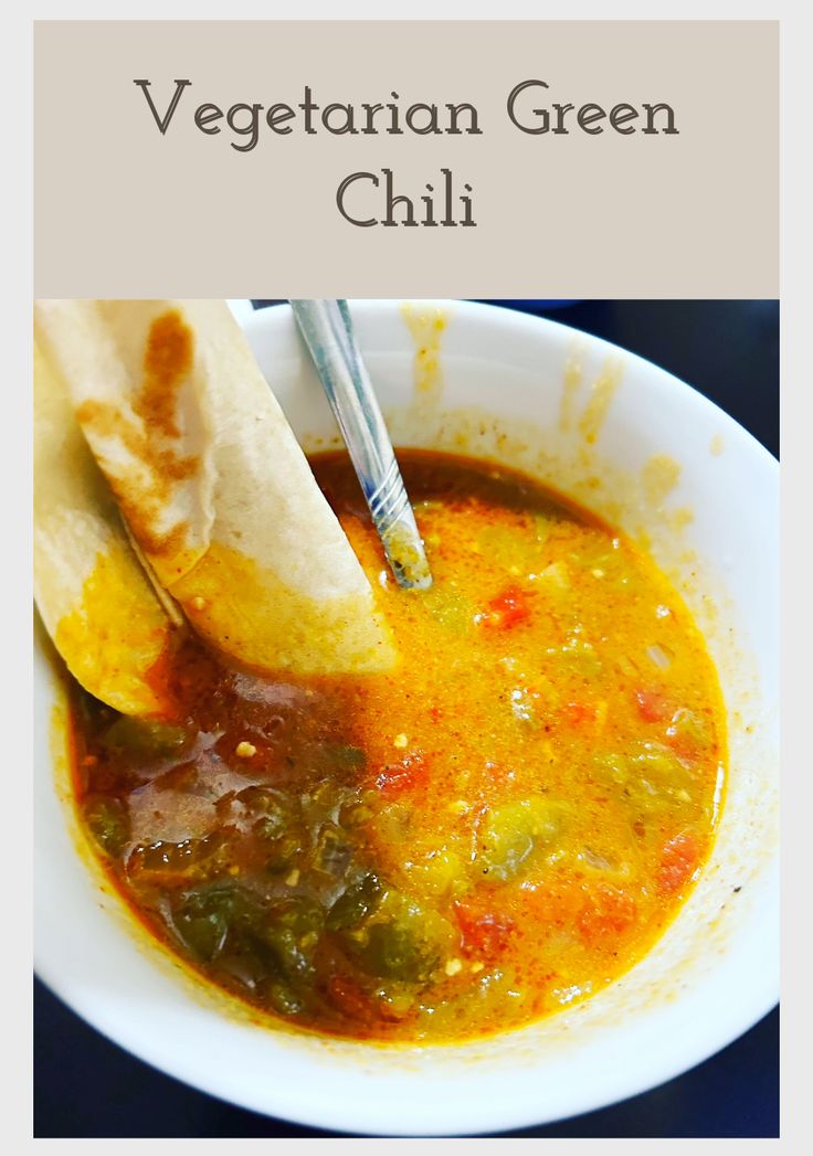 vegetarian green chili in a white bowl with a tortilla on the side and text overlay