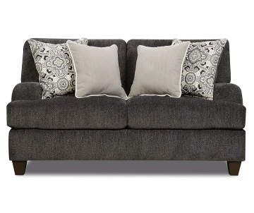 a gray couch with two pillows on it