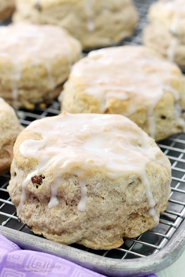 cinnamon roll cookies with icing on a cooling rack