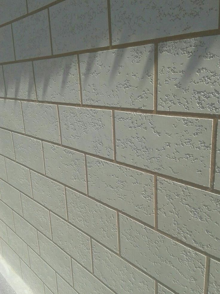 a close up of a white brick wall