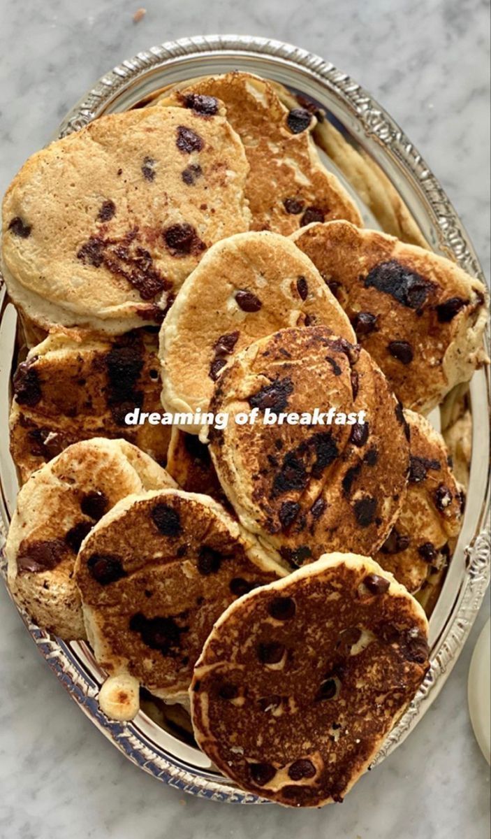 pancakes and chocolate chips on a silver plate