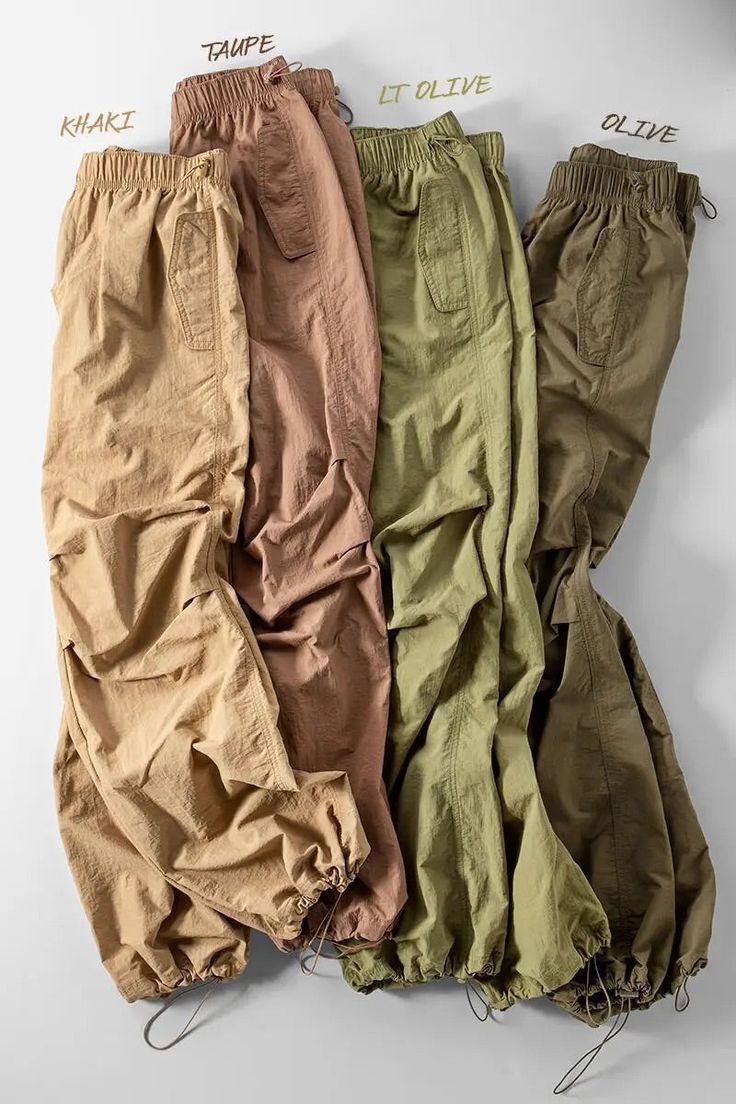 True to Size Fit Parachute Pants for a baggier fit please size up -flowing -adjustable Elastic Fastening At The Waist And Ankles Loose baggy parachute pants Earn some serious style points in these cargo bottoms. Featuring a olive shell material with a cargo design and extreme baggy fit, we're in love. Style with a crop top, fresh kicks and a mini bag for a look that brings all the attitude. Baggy Parachute Pants, Olive Shell, Pants Model, Quick Outfits, Easy Trendy Outfits, Pants Large, Baggy Pant, Casual Style Outfits, Aesthetic Outfits