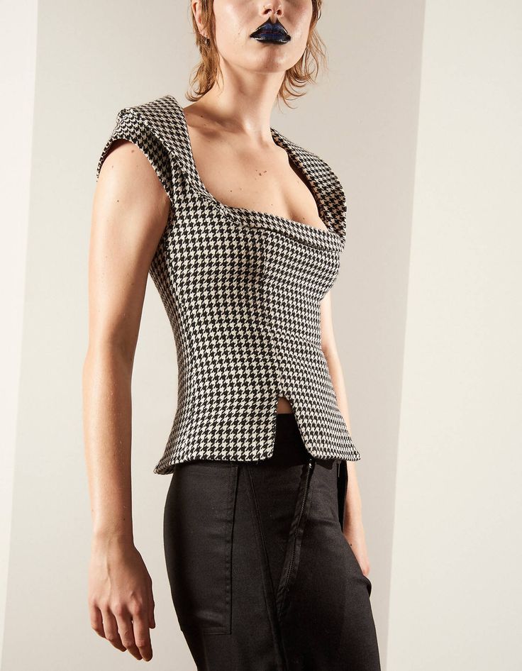 Made in the UK.This top is created by independent London-based fashion label Lula Laora. This garment was designed as part of our AW21 collection 'Simple Pleasures'; the concept of this collection is to allow the wearer to embrace and share their natural desires. The collection mixes masculine and feminine silhouettes and cuts.Mademoiselle top in hounds tooth. Fitted top with plunging square neckline and wide reverse Peter Pan collar. Features capped sleeves, waist darts and hem slits for a subt Masculine And Feminine, Hounds Tooth, Capped Sleeves, Fitted Top, Simple Pleasures, Pan Collar, Peter Pan Collar, Fashion Labels, Square Neckline