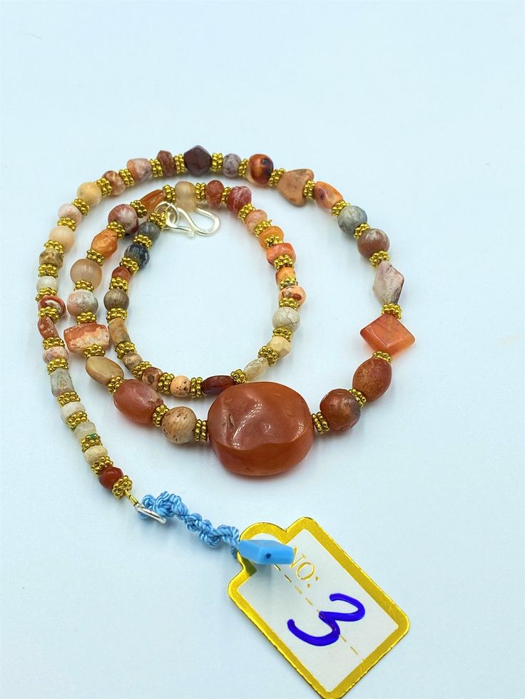 The beautiful old carnelian beads necklace from Ancient Greco-Bactrian times very rare beads from collections very rich in patina patina means in simple words rust as you can see white patina on almost every beads. this is because of this beads are undergrounded for long period of time and get this patina from ground , with the help of this patina you can see very easy authenticity of this beads as well The origin of this beads are from Afghanistan The age of Bactrian Bead are circa 256 to 125 B Amber Beaded Necklaces With Natural Stones For Healing, Spiritual Amber Beaded Necklaces With Natural Stones, Spiritual Amber Beaded Necklace With Natural Stones, Amber Gemstone Beads As Gifts, Carnelian Jewelry With Colorful Beads For Jewelry Making, Orange Beaded Necklaces With Natural Stones In Spiritual Style, Spiritual Orange Beaded Necklace With Natural Stones, Carnelian Colorful Beads For Jewelry Making, Spiritual Carnelian Beads For Jewelry Making