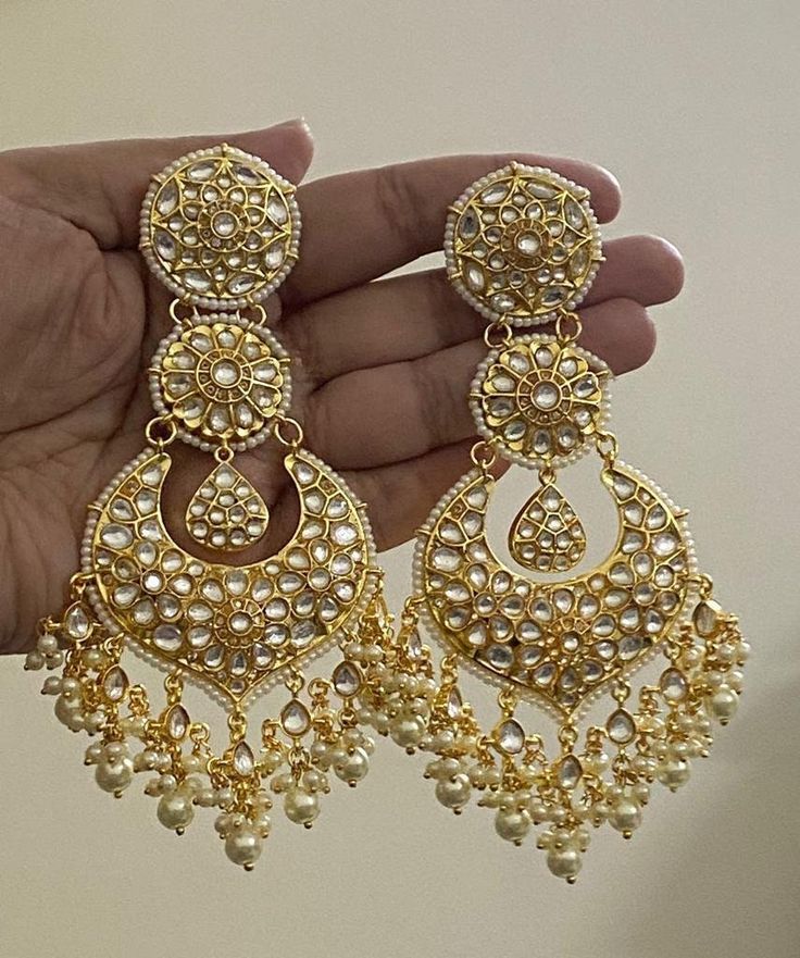 Tyaani inspired Ahmedabadi Kundan big Chand Bali in the Gold finish/Diamond Jhumki/Indian Jhumka/CZ Jhumka/Pakistani Jewelry/Celebrity Earring.  This designer charming Kundan big Chand Bali jhumka is neat and simple for those who wish for light jewelry. Match this jewelry with any of your outfits and flaunt your style. Luxury Heavy Jhumkas For Diwali, Luxury Heavy Chandbalis For Party, Luxury Gold Jhumkas For Navratri, Luxury Jeweled Chandbalis For Wedding, Luxury Chandbalis For Formal Occasions, Navratri Kundan Bridal Earrings With Intricate Design, Bollywood Bridal Kundan Earrings With Intricate Design, Bollywood Style Bridal Earrings With Stone Work For Navratri, Bollywood Style Festive Jhumkas With Stone Work