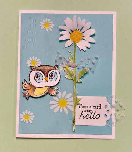 a card with an owl sitting on top of a flower next to a tag that says just a card to my hello