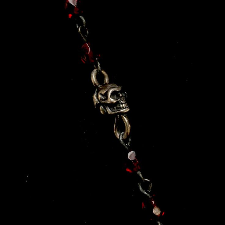 Paired with Ruby Red Austrian Crystals, the Mary Magdalene at la Sainte-Baum shows a contemplative Mary Magdalene looking toward the heavens with the mountains of Baum in the background. A skull sits to her right reminding us of our mortality and memorializing her feast day on on July 22nd. Small Sterling Silver Momento Skulls are interwoven on her Ruby Red chain to remind us that love like life is fleeting. A small crowned Sterling Silver Sacred Heart sits at the center and can be worn in the c Red Spiritual Metal Jewelry, Spiritual Red Metal Necklace, Adjustable Red Jewelry For Rituals, Red Spiritual Bracelets For Rituals, Spiritual Red Bracelets For Rituals, Red Spiritual Jewelry For Rituals, Ceremonial Red Metal Jewelry, Red Spiritual Necklace For Ceremonial Occasions, Ceremonial Spiritual Red Necklace