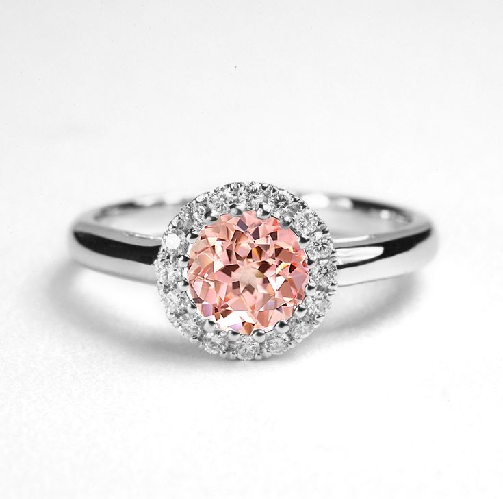 This beautiful Peach Sapphire cluster ring comes with a center round shape 1.0ct lab-grown Peach Sapphire enclosed by 16 round - shape Natural diamonds.  It is a perfect choice for those who are looking for a dainty engagement ring in 9k/14k/18k Yellow, Rose, White Gold or Platinum. It is also a great gift for Christmas, Valentine's day, birthday, anniversary or for celebration for any special occasion. ✯✯ Free UK and USA shipping ✯✯ ✯ ✯ No Custom Charges for USA orders ✯✯  MADE TO ORDER  Please Pink Round Rings With Halo Setting, Pink Halo Setting Round Ring, Pink Halo Ring With Round Setting, Pink Round Halo Ring, Pink Round Cluster Ring With Halo Setting, Pink Cluster Ring With Halo Setting, Pink Diamond Ring With Halo Design, Round Cut Birthstone Ring With Halo Design, Cubic Zirconia Birthstone Ring With Halo Design