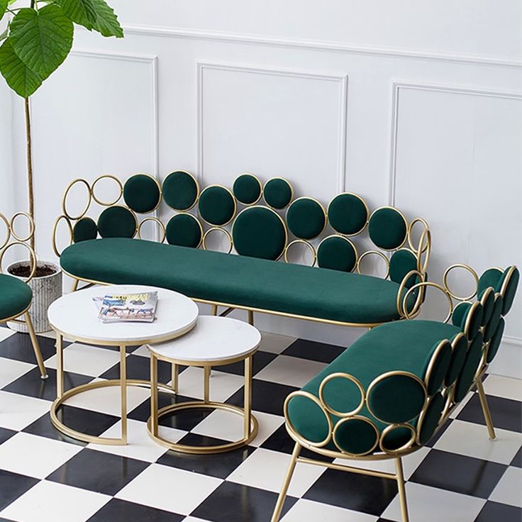 a living room filled with furniture on top of a black and white checkered floor