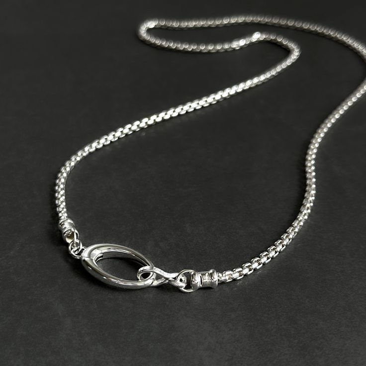 This Solid Sterling Silver Rounded Box Chain Necklace is ideal for creating a classic, timeless look. This weighty, high-quality sterling silver chain is complete with a large oval push clasp, allowing for interchangeable pendants. Details: Chain: Solid Sterling Silver rounded box chain, 2.5mm Clasp: Solid Sterling Silver hinged oval push clasp, 22mm Sizes: 16 inches to 24 inches Shipping: Ready to ship within one business day Complimentary shipping in the USA Complimentary gift wrap Silver Oval Box Chain Necklace, Silver Oval Necklace With Box Chain, Modern Oval Link Chain Necklace With Sterling Silver Clasp, Classic Silver Chain Necklace With Oval Pendant, Minimalist Necklace With Sterling Silver Oval Link Clasp, Sterling Silver Oval Link Chain Necklace, Sterling Silver Chain Necklace With Oval Pendant, Sterling Silver Oval Link Chain Necklace As Gift, Everyday Silver Oval Pendant Chain Necklace