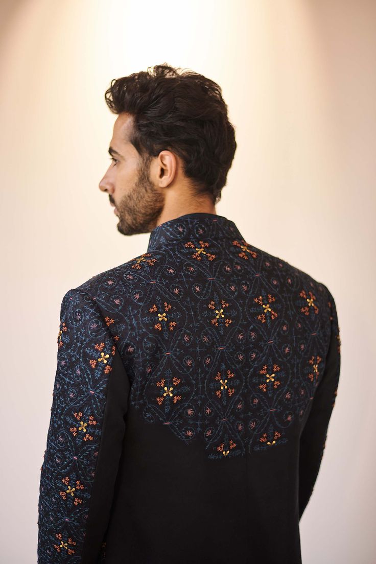 Editor's Note Featuring Kashmiri Jamawar Hand Embroidered Contemporary Jacket. Paired With Tone On Tone Drape Kurta And Tapered Trousers. Fabric: Linen Silk Color: Blue Component: Jacket, Kurta, Trousers Care: Dry Clean Only About the Designer After establishing himself as the leading couturier in the industry of menswear, Jatin Malik went on to explore luxury footwear. You can order online these amazingly designed handmade shoes that are being offered in classy Caligae and Peshawari patterns! W Velvet Embroidery Design, Western Outfits For Men, Indo Western Outfits For Men, Jatin Malik, Indo Western Outfits, Blouse Yoke, Bollywood Theme, Black Outfit Men, Velvet Embroidery