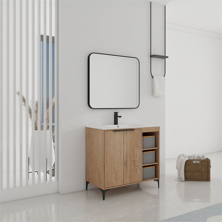 a bathroom with a sink, mirror and towel rack on the wall next to it