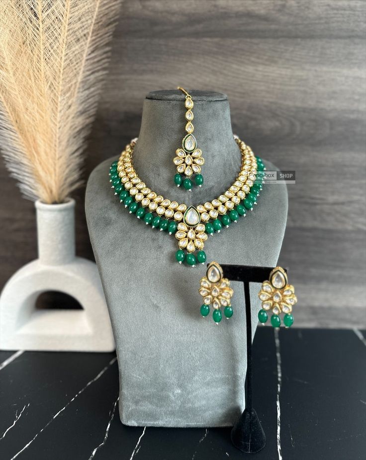 Rani green Drop Kundan back Meenakari Necklace set. Expertly crafted with Rani green Kundan and Meenakari work, this necklace set adds a touch of elegance to any outfit. Its intricate design and vibrant color make it a standout piece. Perfect for special occasions or as a statement accessory. Elegant Green Meenakari Bridal Necklace, Festive Green Kundan Jewelry, Festive Emerald Jewelry Sets, Green Kundan Bridal Necklace Hand Set, Green Kundan Cutdana Necklace For Diwali, Green Kundan Necklace With Cutdana For Diwali, Green Chandbali Jewelry For Diwali, Elegant Green Necklace With Meenakari, Festive Green Meenakari Jewelry