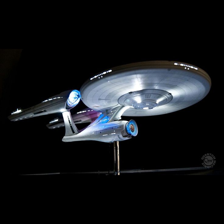 a model of a star trek ship in the dark