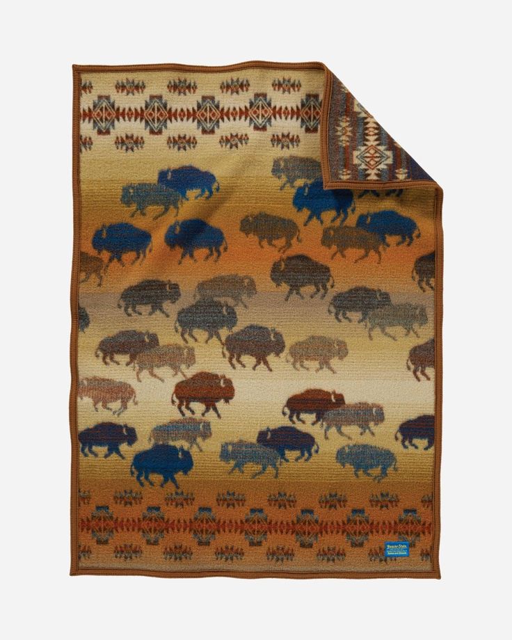 a blanket with bisons on it