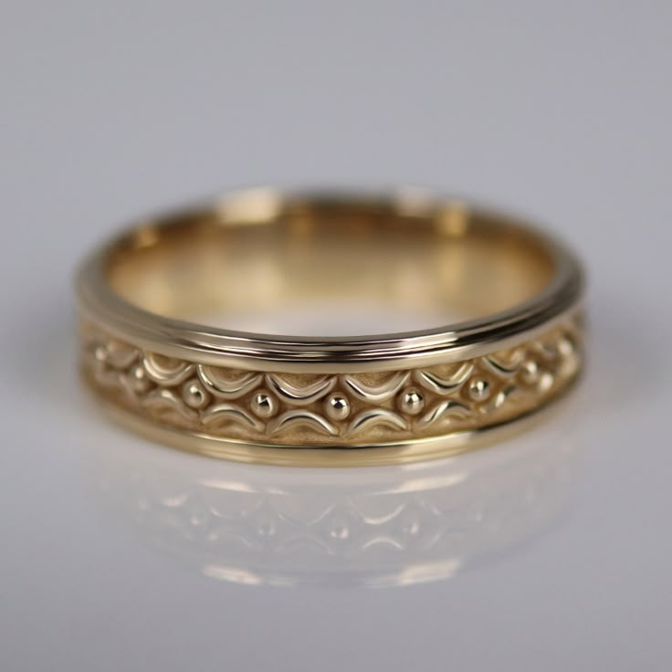 Inspired by Zora's River in the Legend of Zelda: Ocarina of Time, the center of this band features curving forms and golden bubbles, inspired by Zora architecture.Please note: Since this ring's design wraps all the way around the band, it cannot be resized.✶ solid 14 karat recycled yellow, white, or rose gold✶ band measures 5.4mm wide x 1.7mm thick✶ comfort fit This ring will be handmade just for you.Please allow 4-6 weeks production time before shipping. Men’s Engagement Ring, Men’s Engagement Rings, Unique Engagement Rings For Men, Great Deku Tree, Male Engagement Ring, Deku Tree, Hero Of Time, Zelda Ocarina Of Time, Golden Jewelry