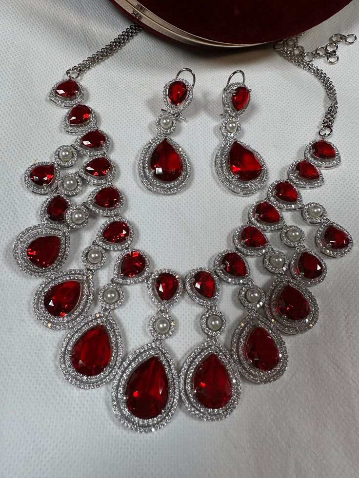 color red.Usually same day shipping available if order before 2 pm Eastern time. Guaranted shipped in 1-2 days. Luxury Red Jewelry For Gift, Red Party Jewelry With Jewels, Red Crystal Necklaces For Celebrations, Red Ruby Round Necklaces, Luxury Red Ruby Jewelry, Luxury Red Gemstone Jewelry, Elegant Red Necklace With 17 Jewels, Fine Jewelry Red Ruby, Red Gemstone Necklace For Party