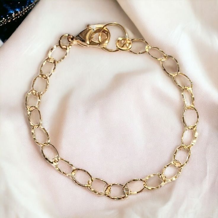 Shiny 14K Gold filled bracelet chain. Round 7mm Links. 14k gold filled is a beautiful more affordable alternative to solid gold as it is a genuine layer of gold permanently bonded onto base metal with heat and pressure that contains 100+ times more gold than gold plated. It is extremely durable, won't chip or flake, tarnish-resistant, and a great alternative to expensive solid gold jewelry. It looks great and with proper care Gold-filled jewelry can also be worn by people with sensitive skin since its 100% Hypoallergenic, Lead and nickel free. Choose Size and add your charms! **All charm bracelets include an extension chain for the perfect fit All sizes available. Send message at checkout if you require a different size. SEE LINKS BELOW to add charms to your cart. To see all of our gold & Hypoallergenic Gold Bangle Chain Bracelet, Hypoallergenic Gold Chain Link Bracelet, Gold Chain Bangle Bracelet With Lobster Clasp, Hypoallergenic Gold Oval Link Bracelets, Gold Hypoallergenic Oval Link Bracelets, Gold Hypoallergenic Chain Link Bracelet, Hypoallergenic Gold Chain Link Bracelets, Hypoallergenic Gold Oval Link Bracelet, Gold Bangle Charm Bracelet With Lobster Clasp