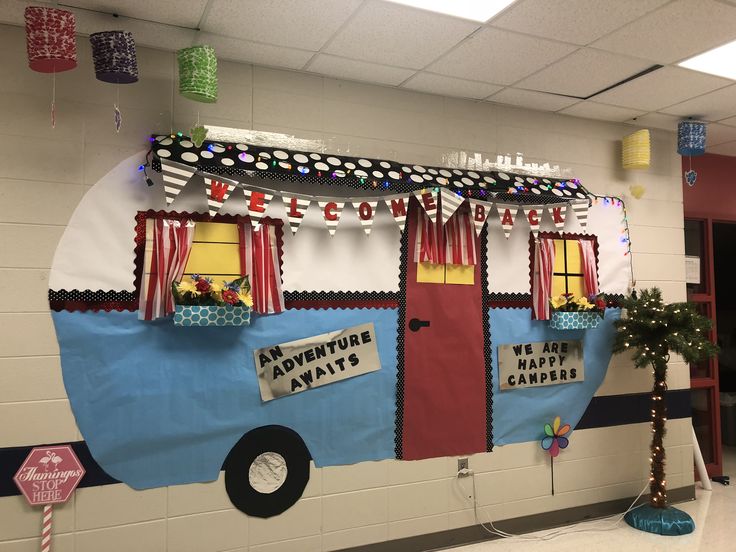 a school bus decorated for christmas with decorations on the front and side wall, along with lights